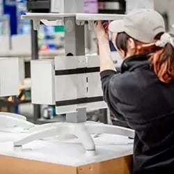 woman-assembling-a-medical-cart-on-a-production-line-at-hui-medical-carts