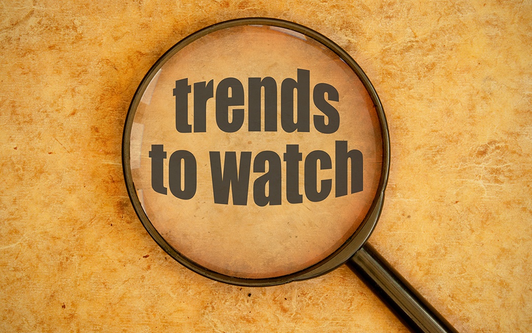 trends to watch text under a magnifying glass