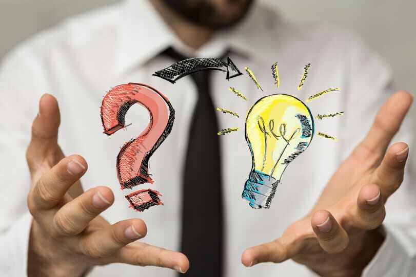 two hands palms up holding a question mark and light bulb