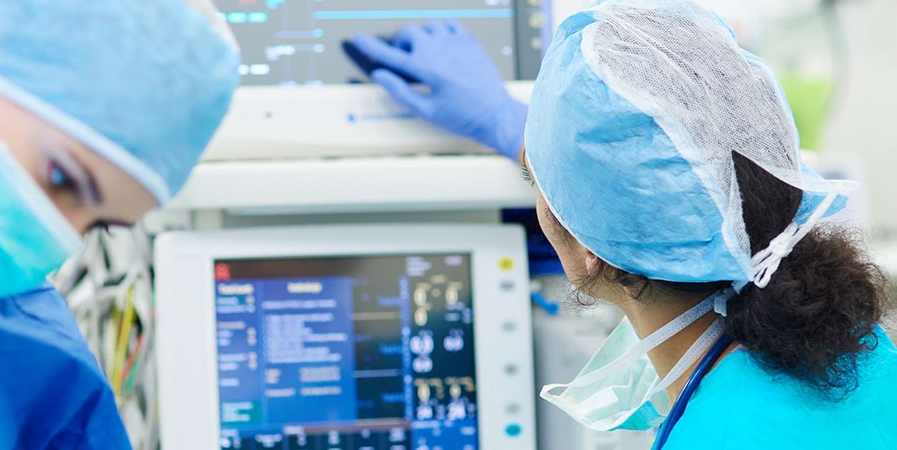 person in scrubs looking at custom medical cart