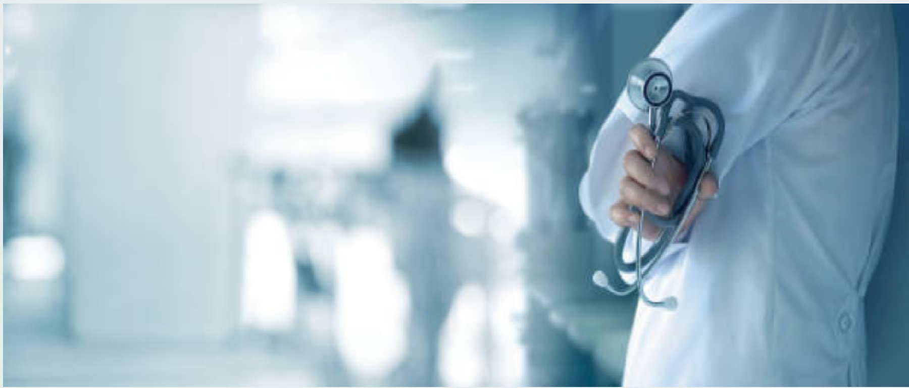 doctor standing with arms crossed holding a stethoscope 